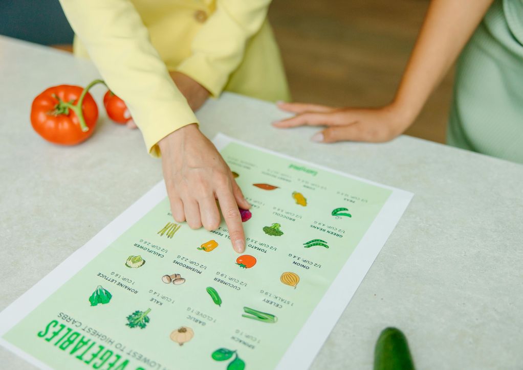 Health Coach pointing at nutritional program